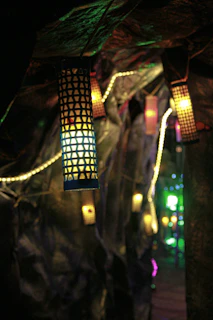 A cozy birthday passage decorated with hanging lanterns and subtle lighting, guiding guests to the celebration.