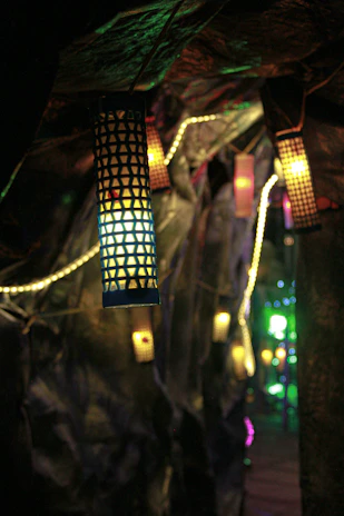 A cozy birthday passage decorated with hanging lanterns and subtle lighting, guiding guests to the celebration.