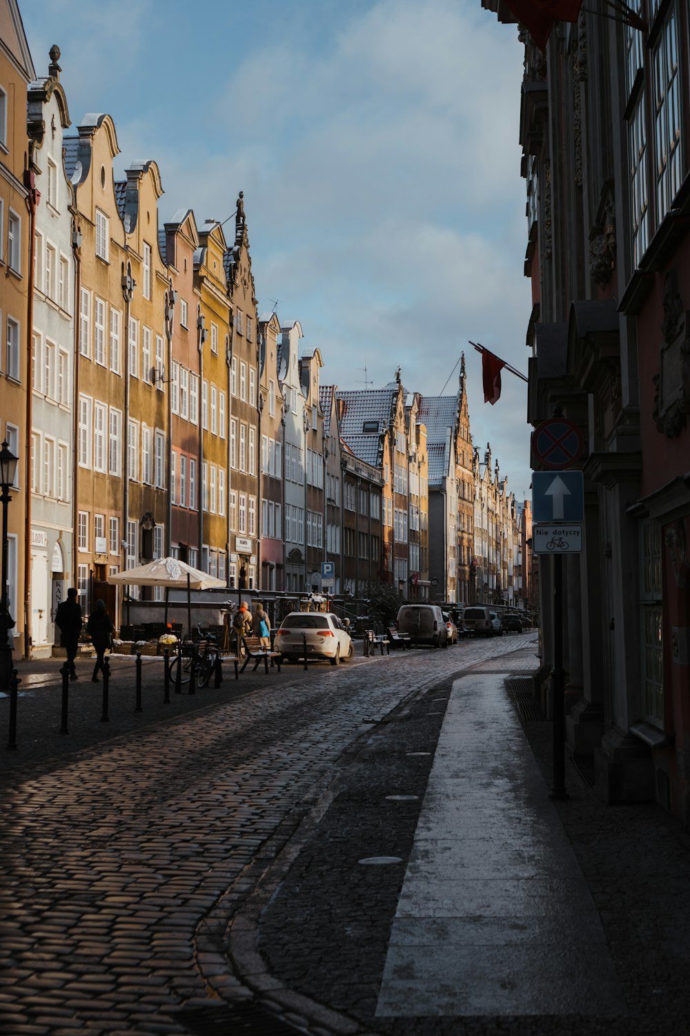 a row of buildings line a street in a city