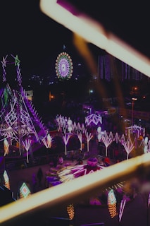 A vibrant scene of people enjoying various fun activities under colorful lights, representing the excitement of the Fun Pass.