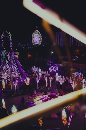 A vibrant scene of people enjoying various fun activities under colorful lights, representing the excitement of the Fun Pass.