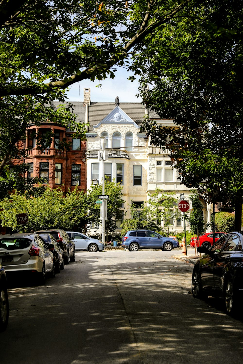 a street with cars parked on both sides of it