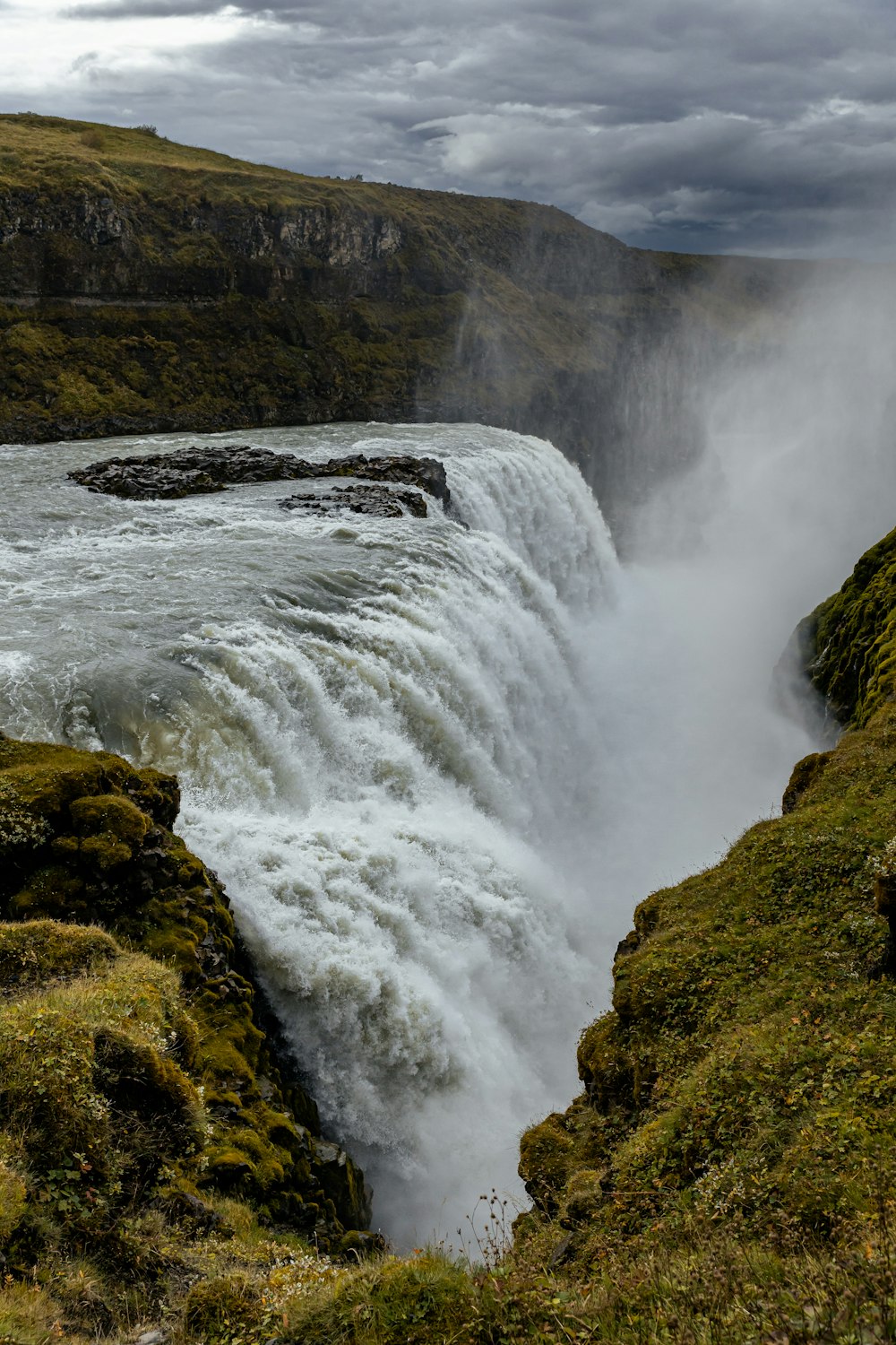 a large waterfall with water coming out of it