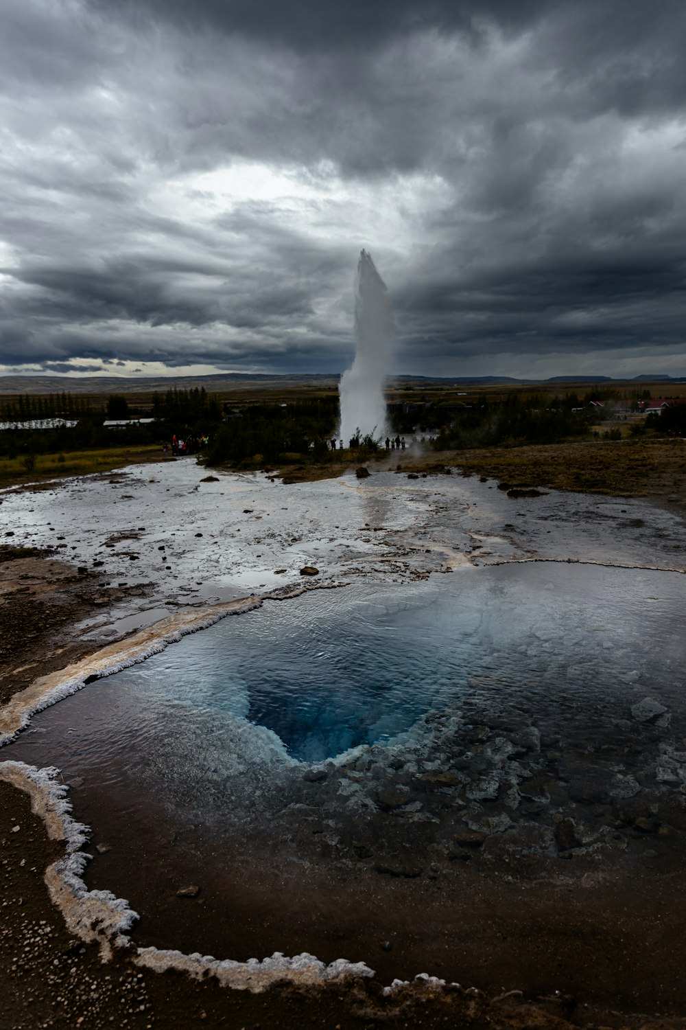 a geyser spewing out water into the sky