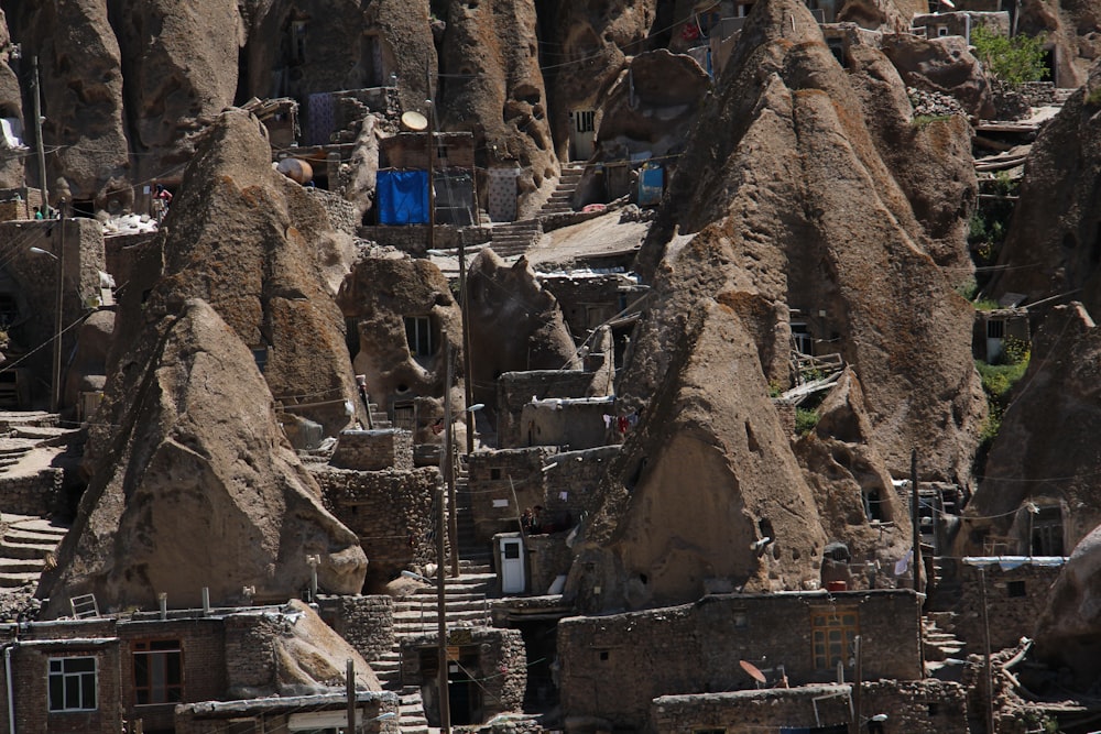 a large group of rocks with houses built into them