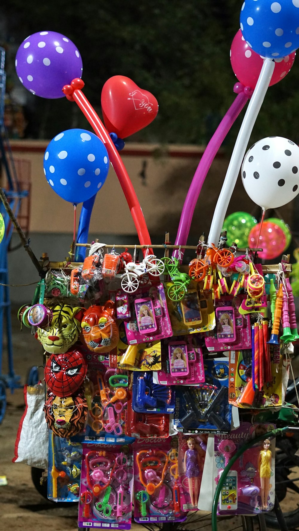 a cart filled with balloons and confetti