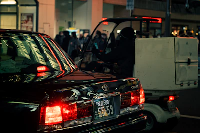 A sleek silver delivery truck with the Supply Chain Logistics Limited logo cruising through a cityscape at dusk.
