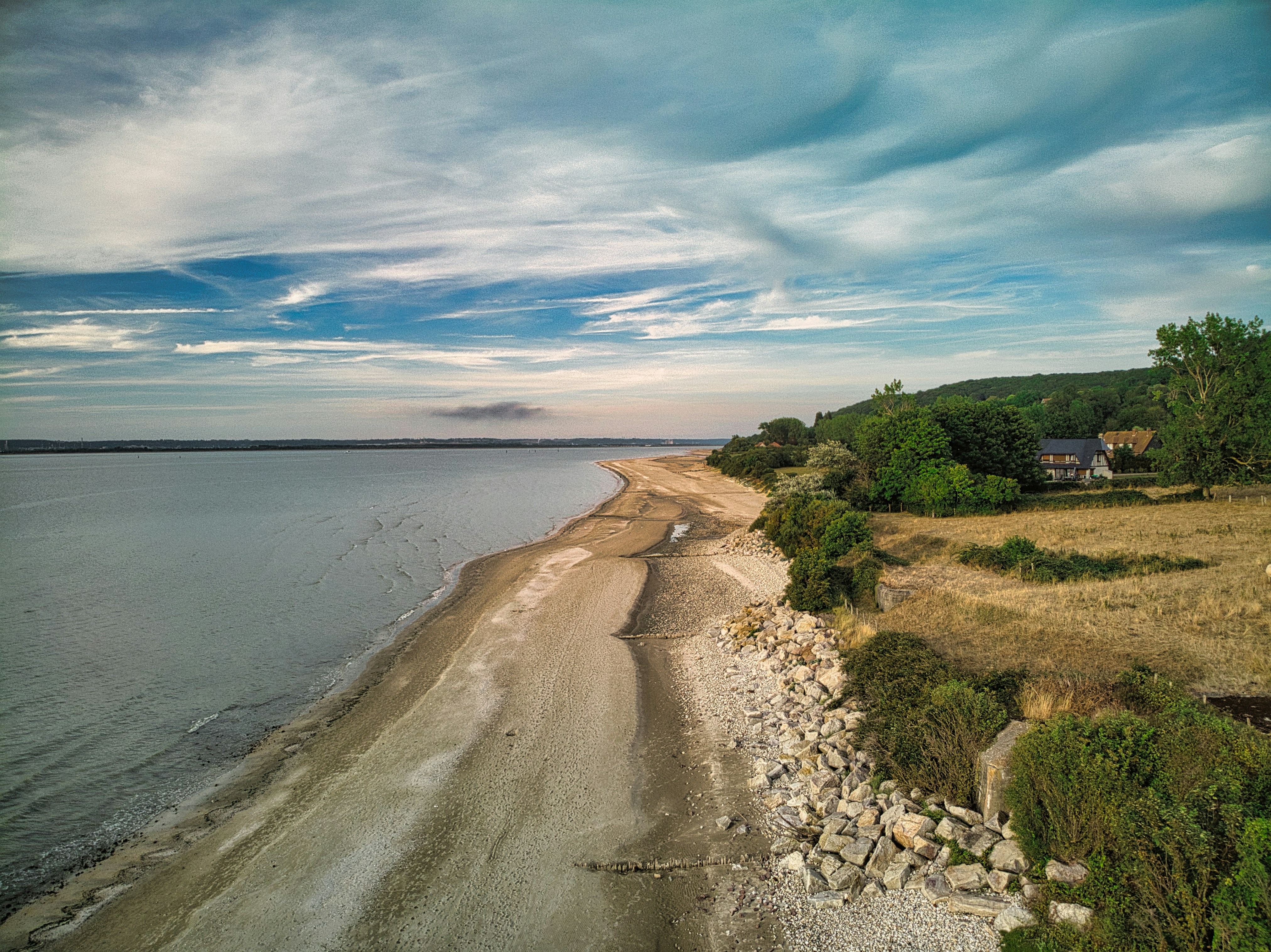 an aerial view of a beach and a body of water