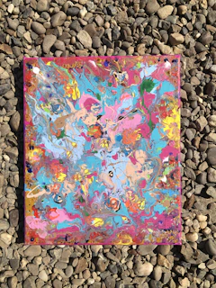 Child’s vibrant painting of rocks and minerals with yellows and soft shadows