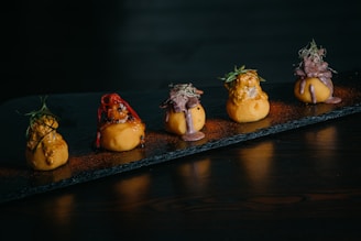 a row of food items sitting on top of a table