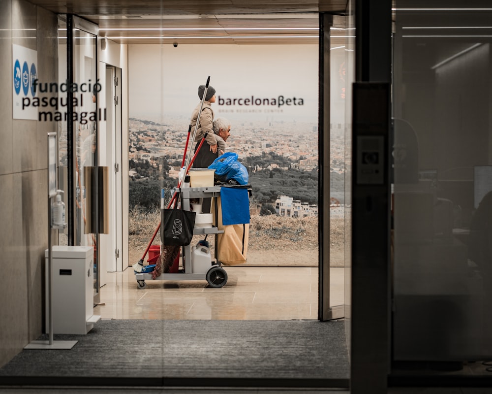 a man is cleaning the floor in a building