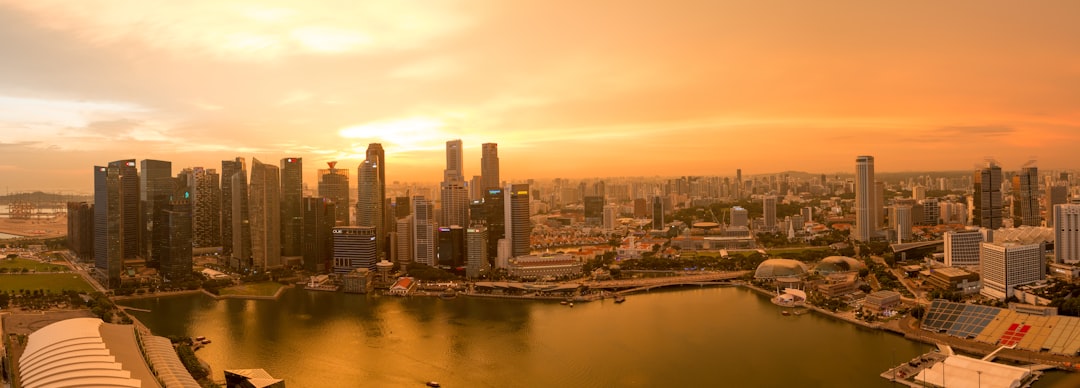 a large body of water surrounded by tall buildings,