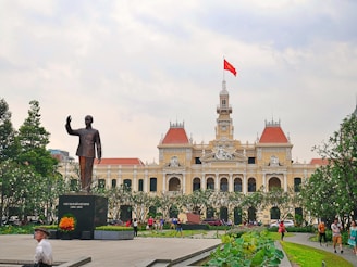 a statue of a man in front of a building