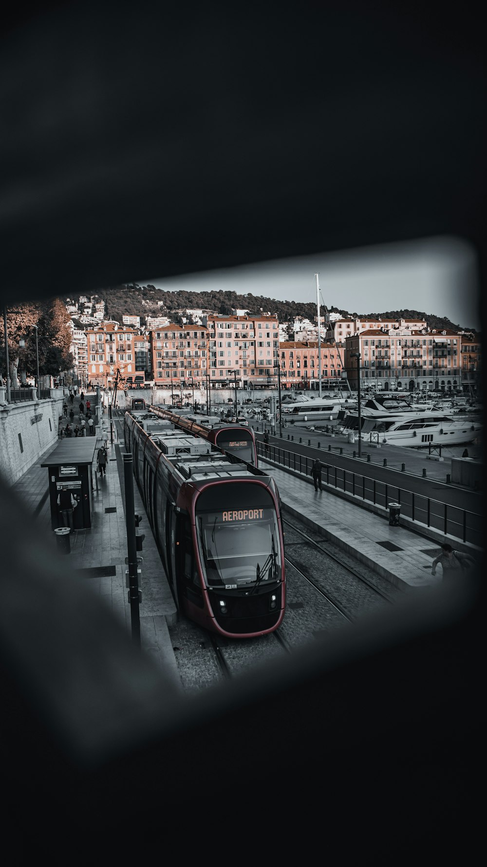 a black and white photo of a train at a train station