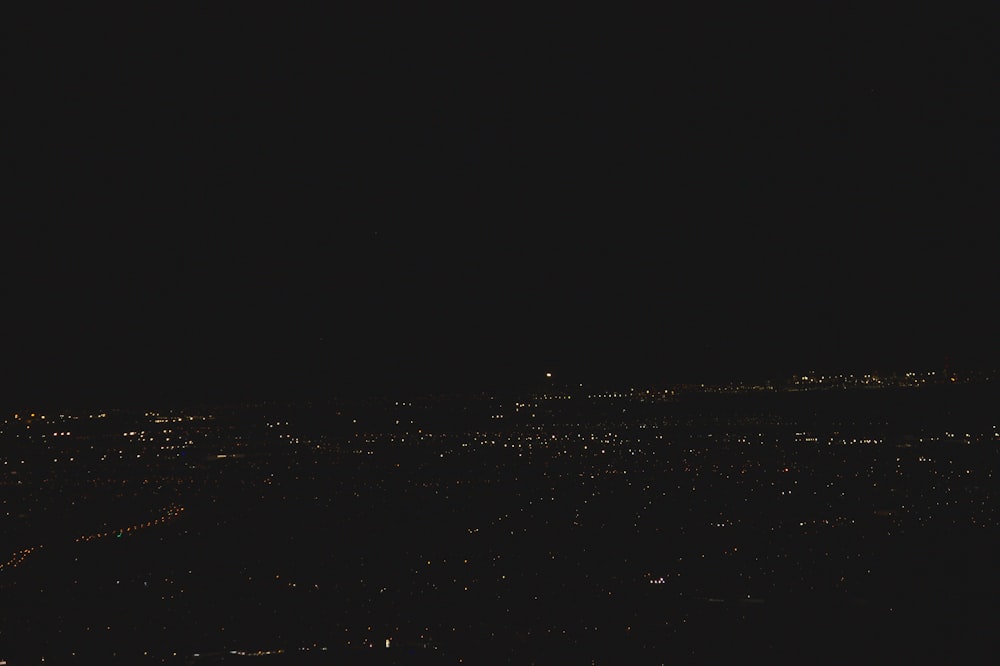 a view of a city at night from a plane