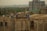 Workers are constructing a building, surrounded by scaffolding and construction materials. Some workers are wearing safety helmets and vests. The scene is urban with a partially built high-rise in the background and various trees and houses in the distance.