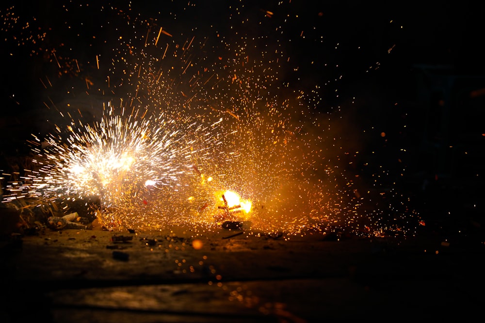 a bunch of fireworks that are lit up in the dark