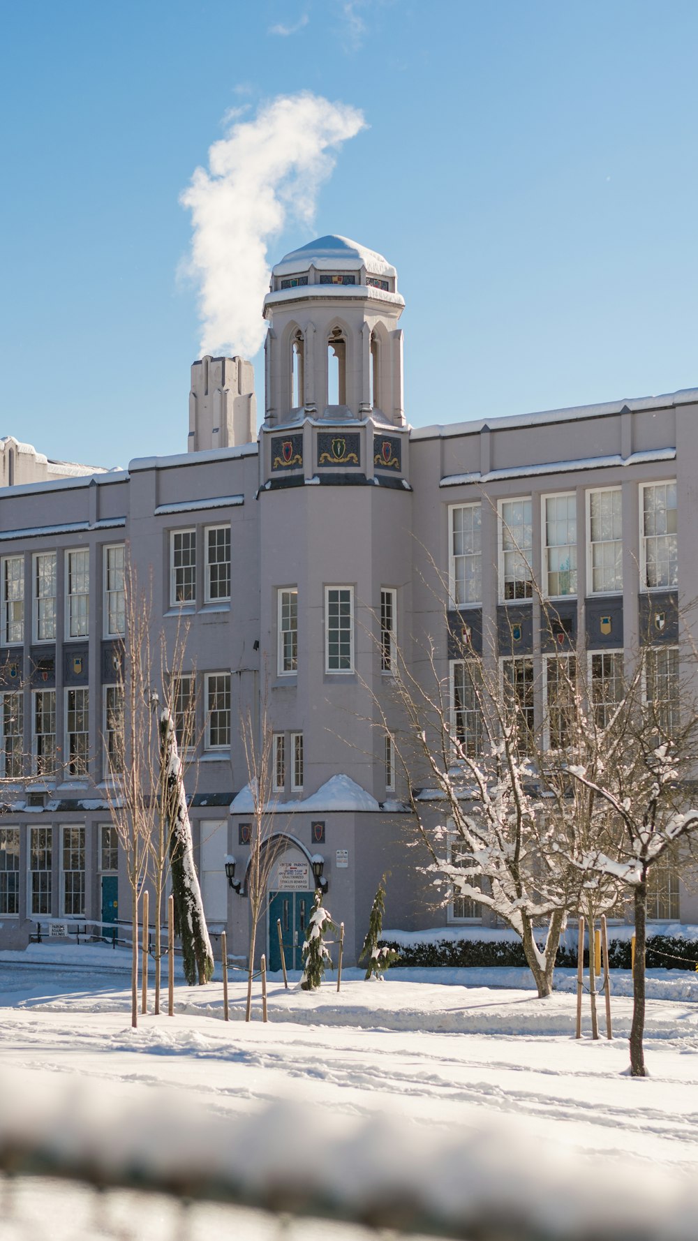 a building with a clock tower in the snow