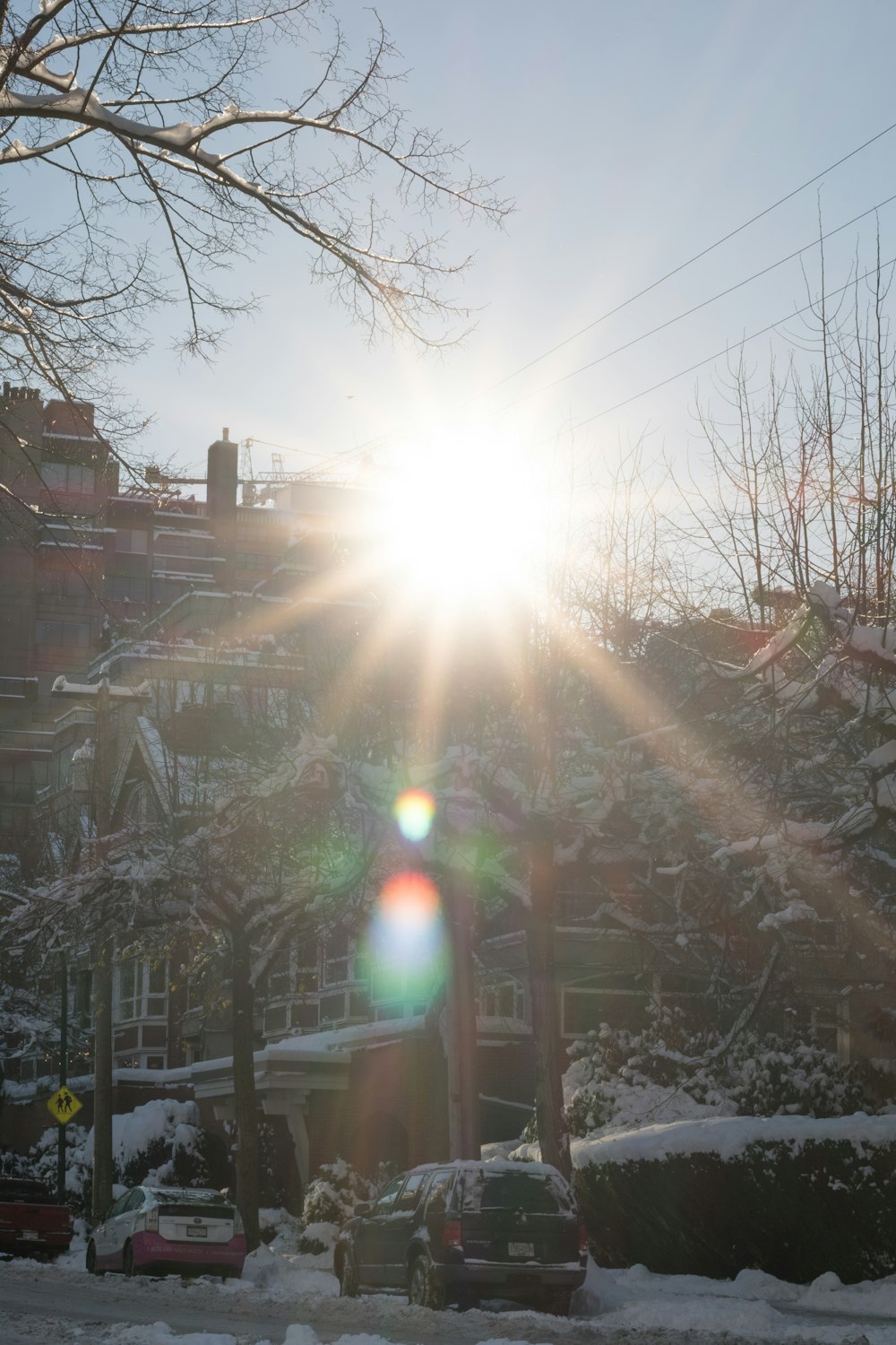 the sun is shining brightly over a snowy area