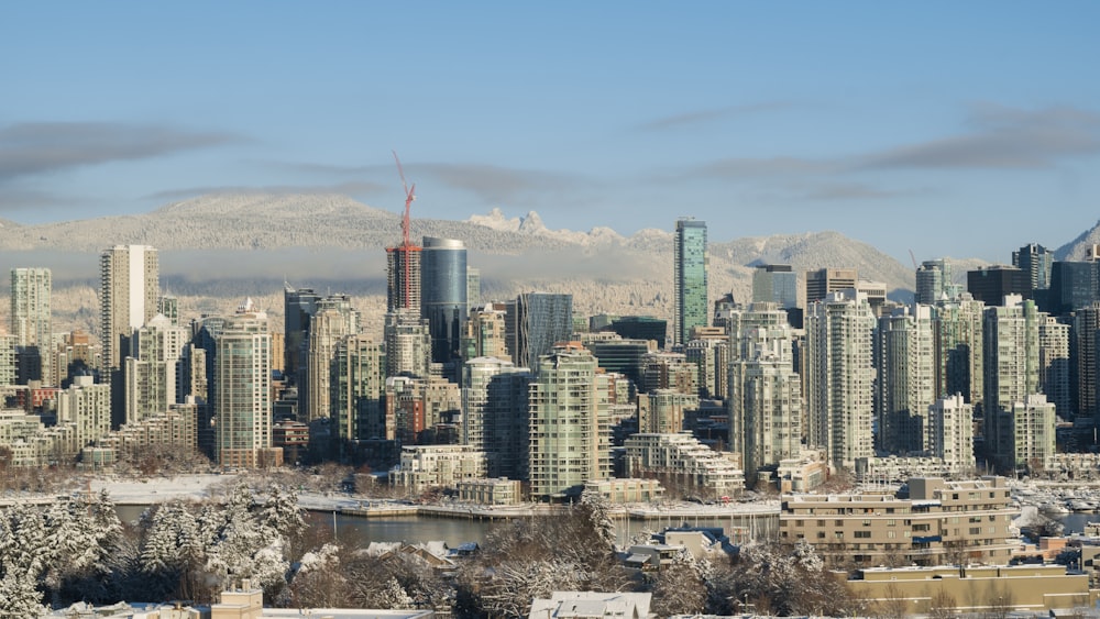 a view of a large city with a mountain in the background