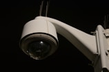 a close up of a security camera on a pole
