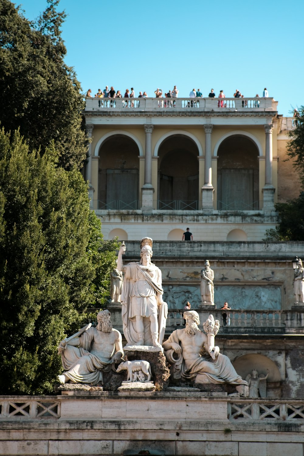 a group of people standing on top of a building