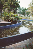 A serene outdoor space showcasing a combination of natural elements and artistic landscaping design.