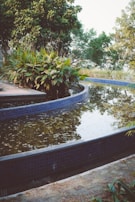 A beautifully installed water feature surrounded by lush landscaping.