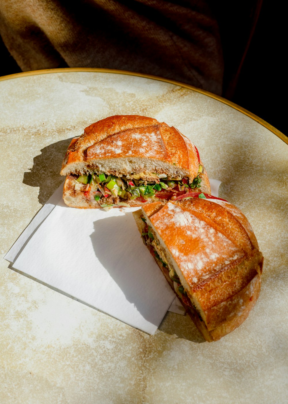 a sandwich cut in half sitting on top of a table