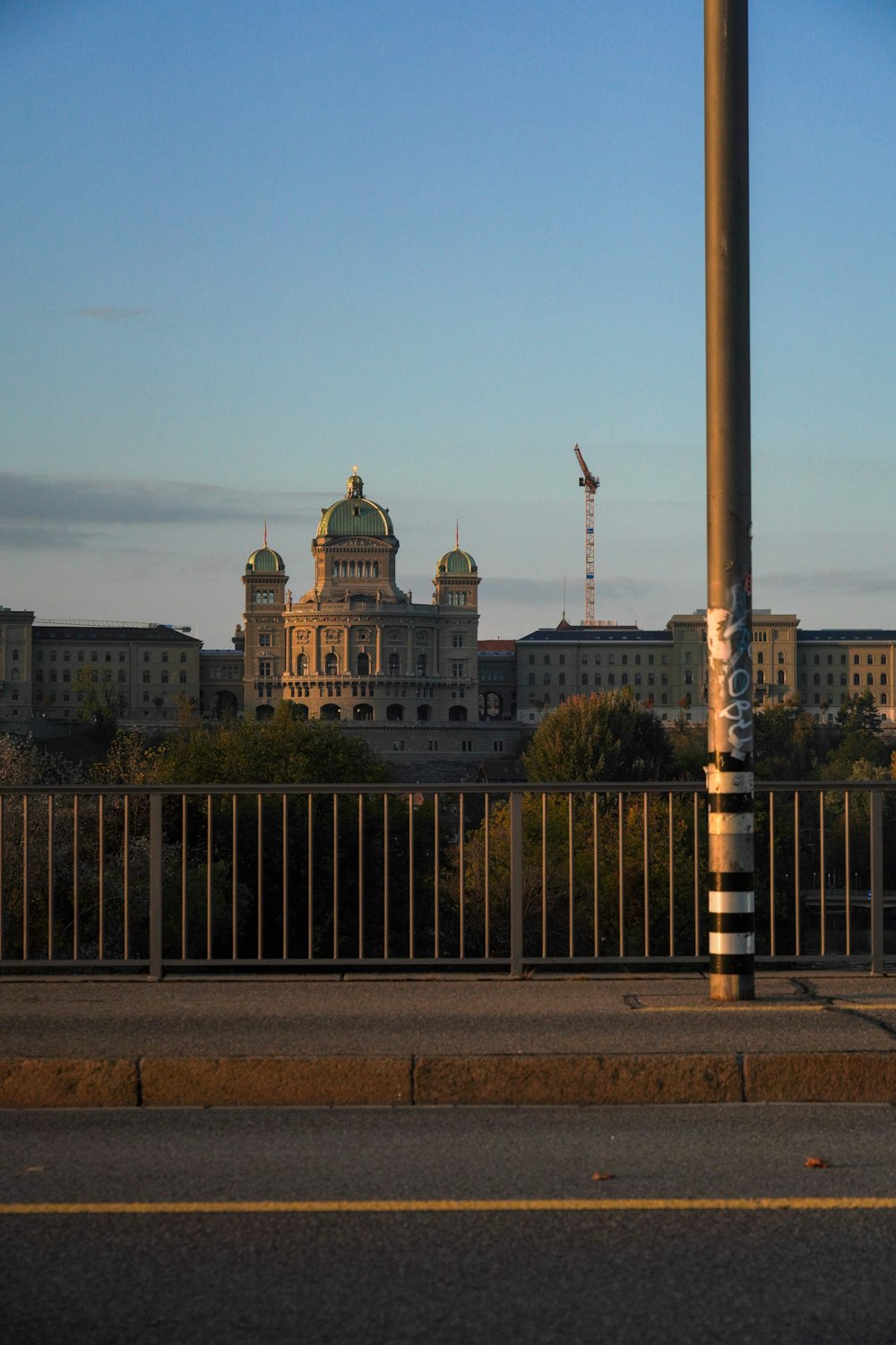 a street light sitting next to a tall building