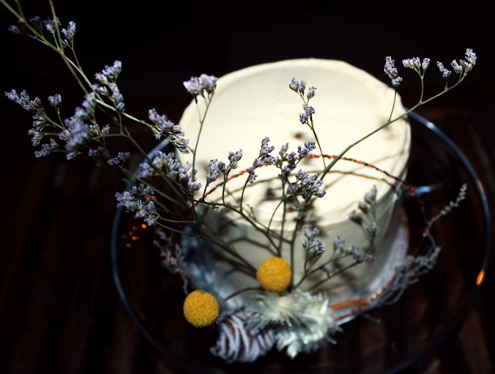 a close up of a cake on a plate with flowers
