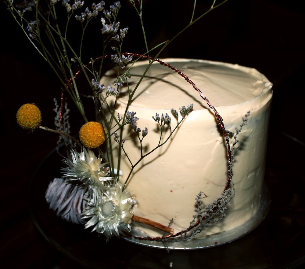 a close up of a cake on a plate with flowers