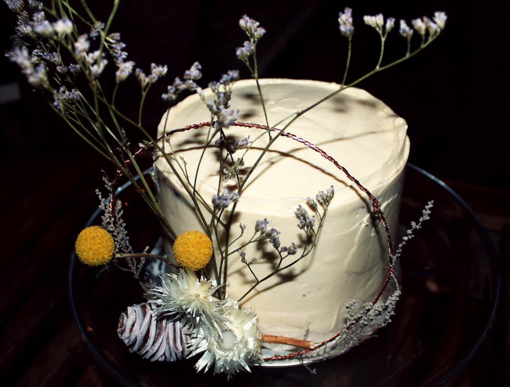 a close up of a cake on a plate with flowers