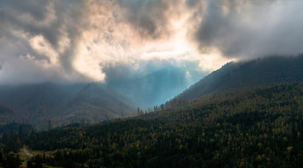 a view of a mountain range with a lot of clouds