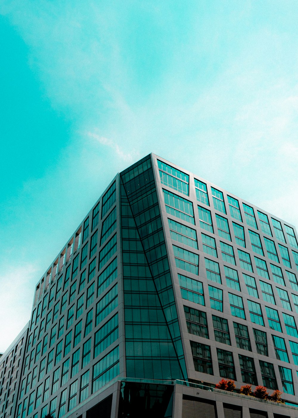 a very tall building with a clock on it's side