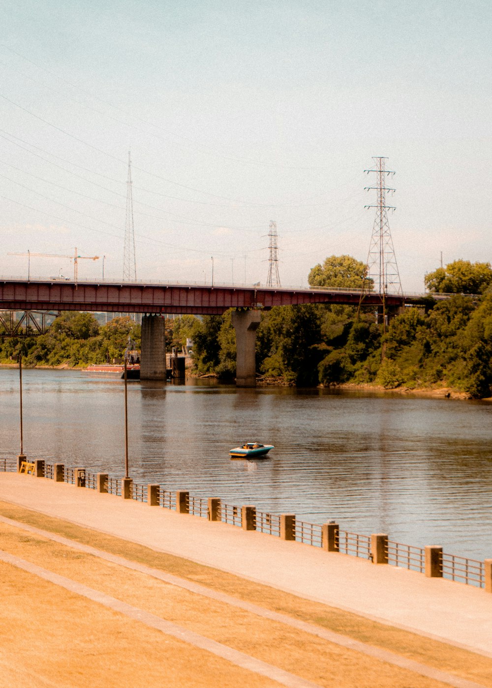 a train traveling over a bridge over a river