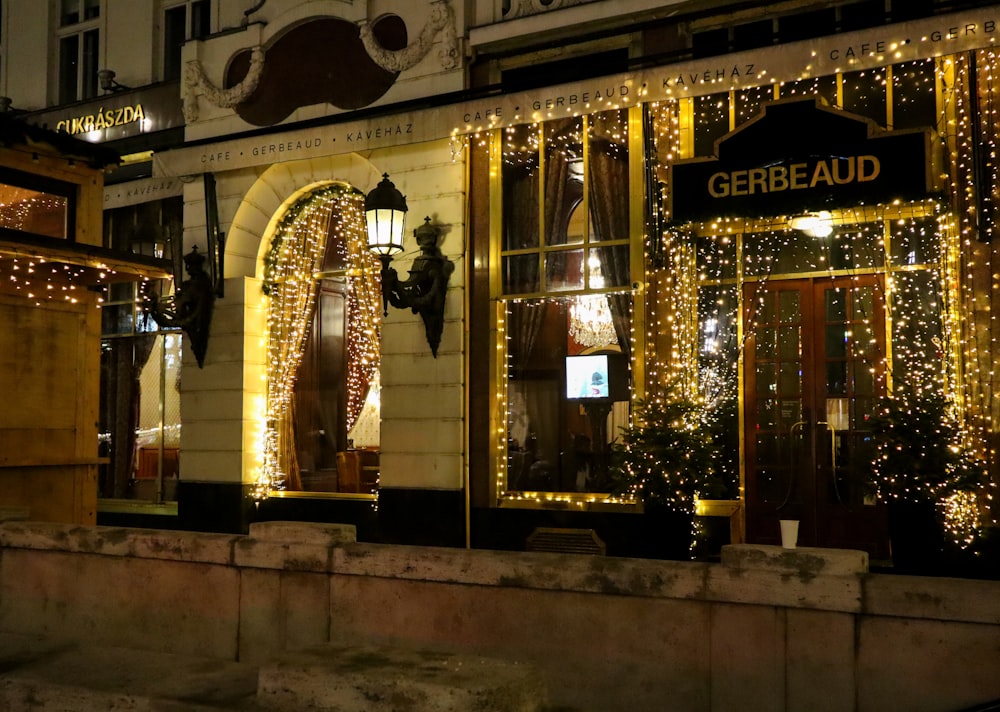 a lit up building with a sign that says gerba aid