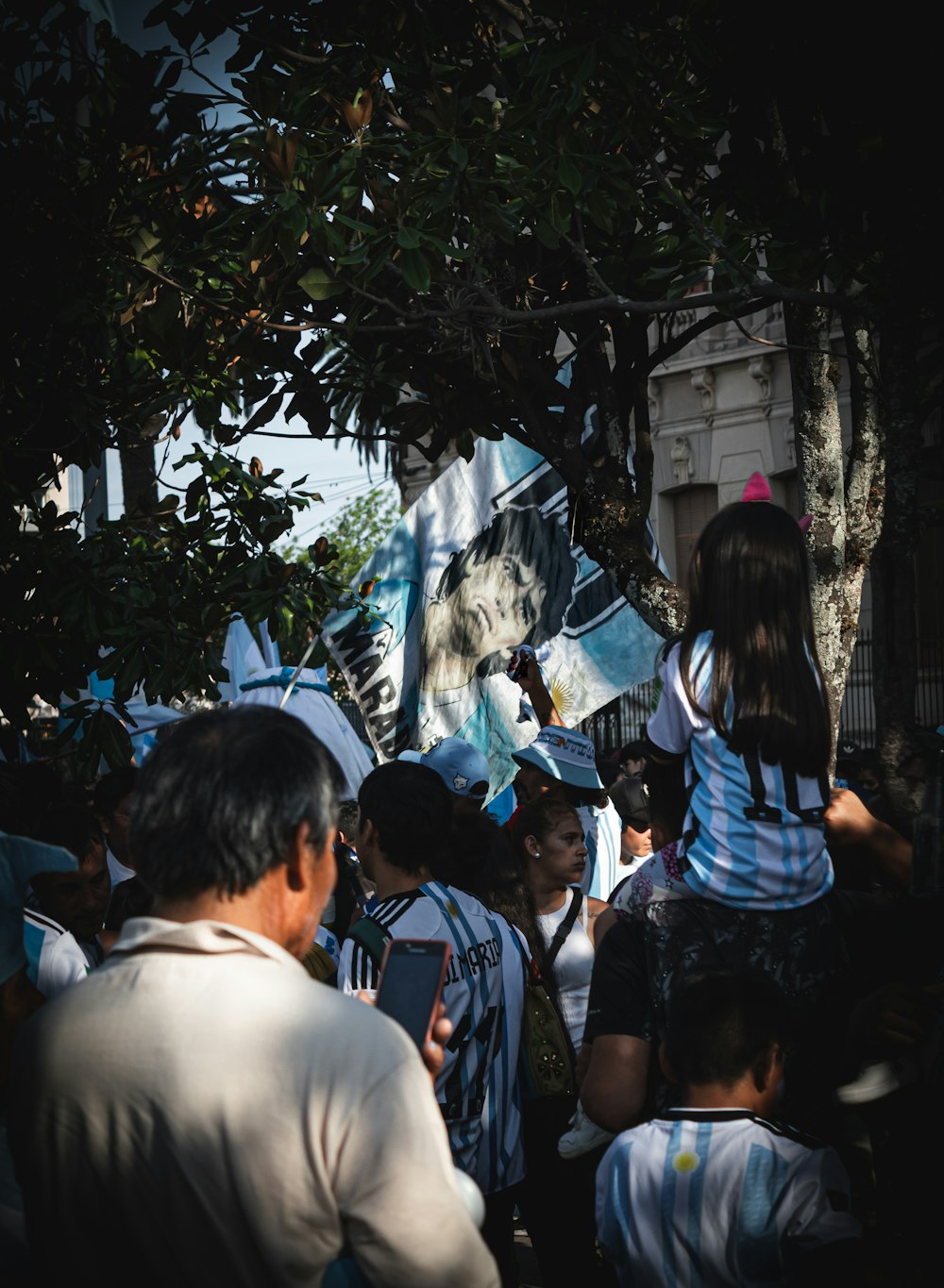 a group of people standing around each other