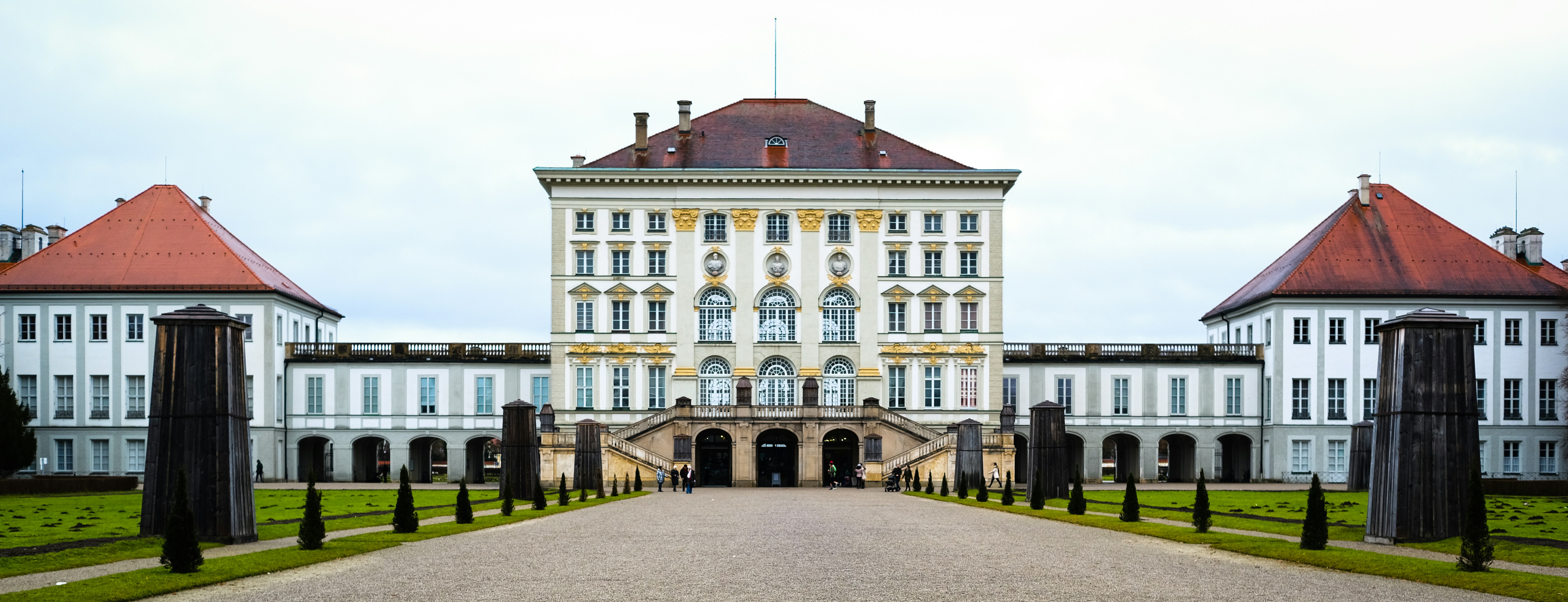 a large white building with a red roof