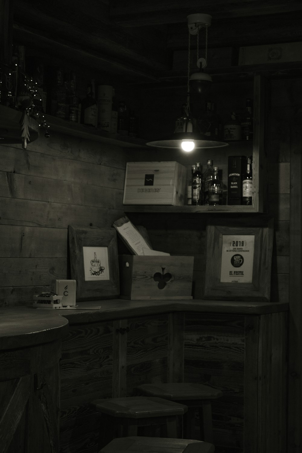 a black and white photo of a bar