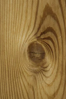 Close-up of natural wood textures highlighting the grain and knots.