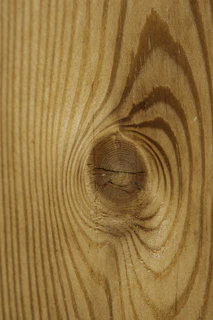 Close-up of natural wood textures highlighting the grain and knots.