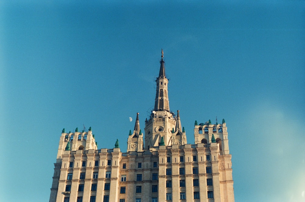 a very tall building with a clock on it's side