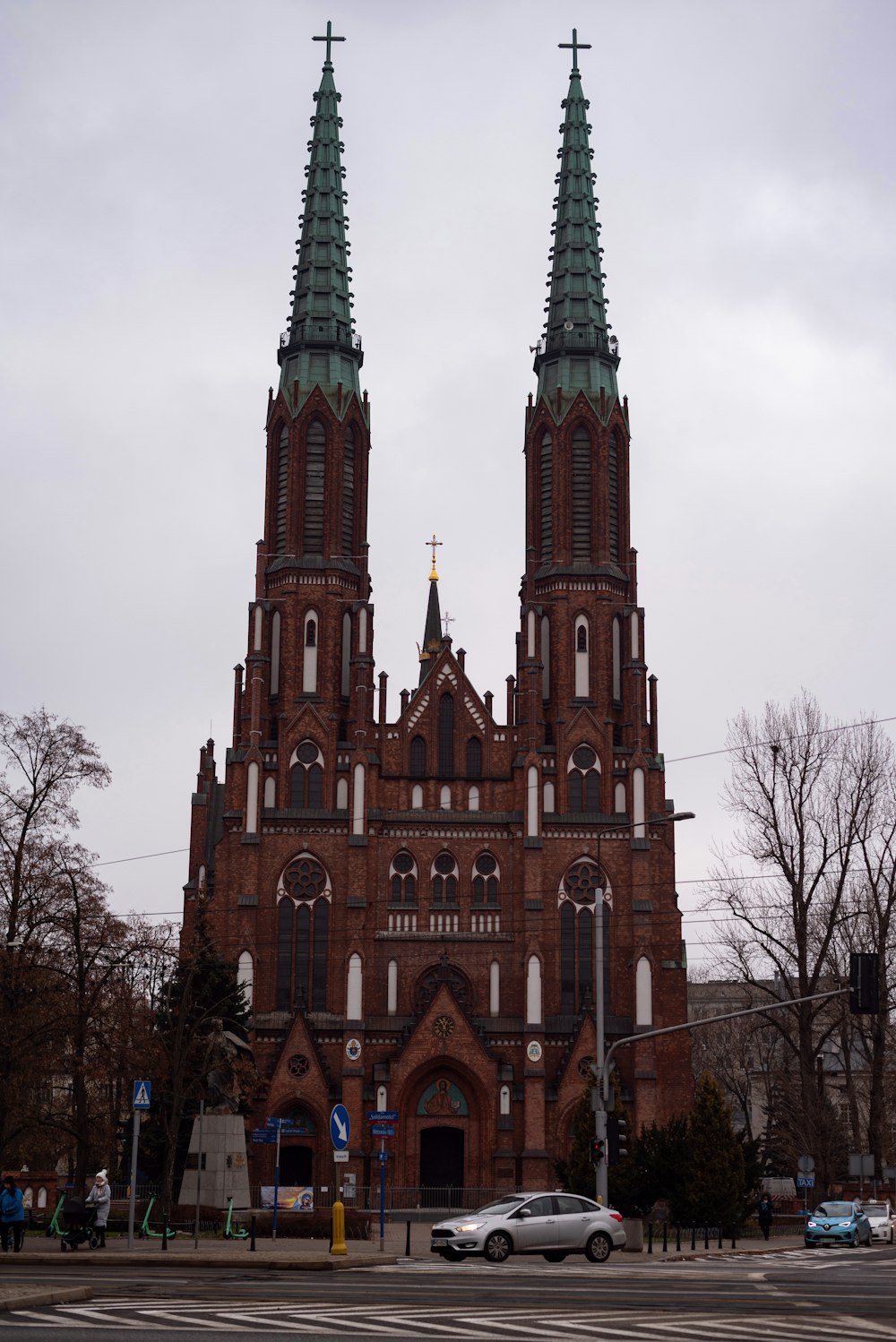 a large church with two towers and a cross on top