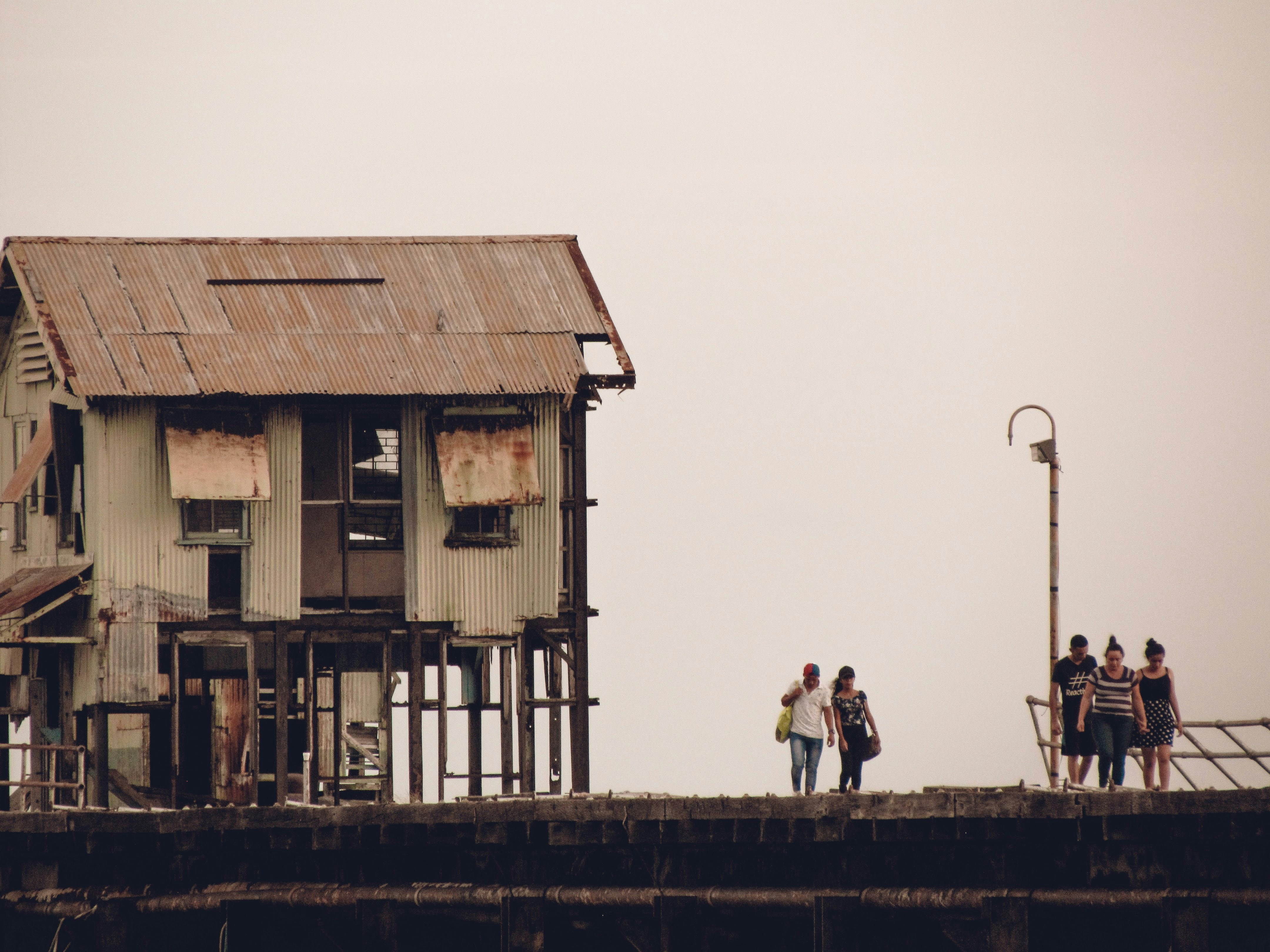a group of people standing on top of a building