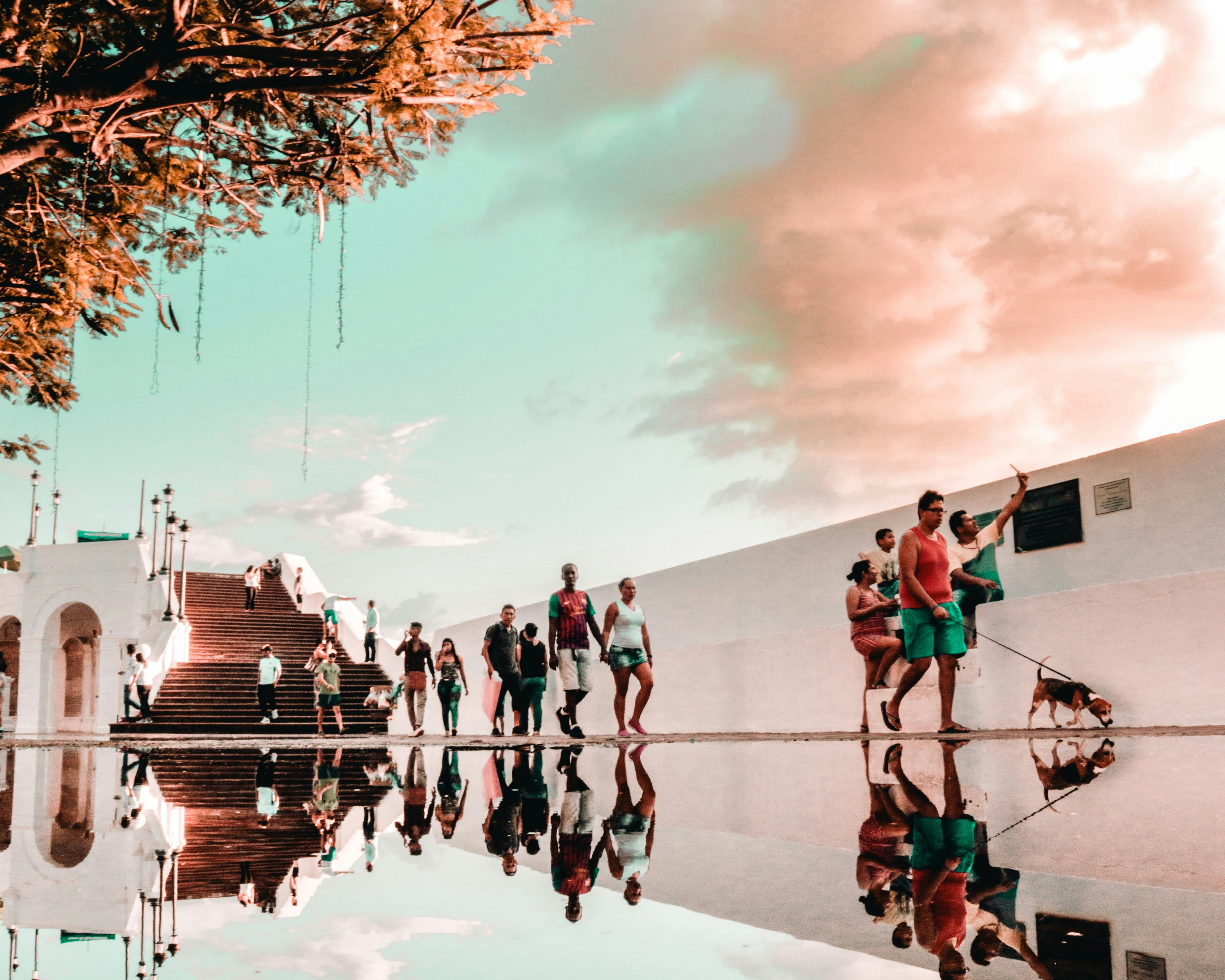 woman wearing yellow long-sleeved dress under white clouds and blue sky during daytime