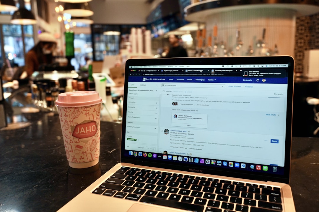 coffee shop owner reviewing analytics on laptop