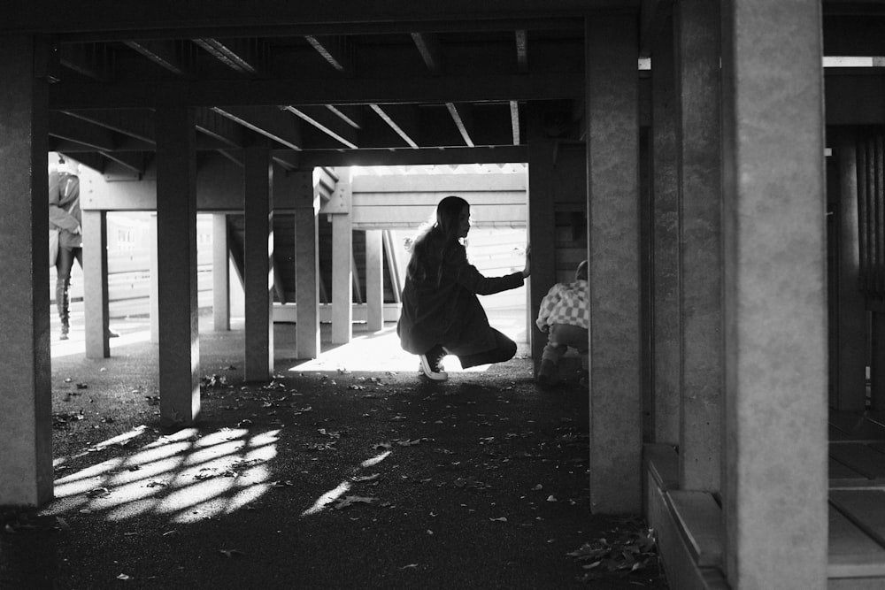 a black and white photo of a person in a room