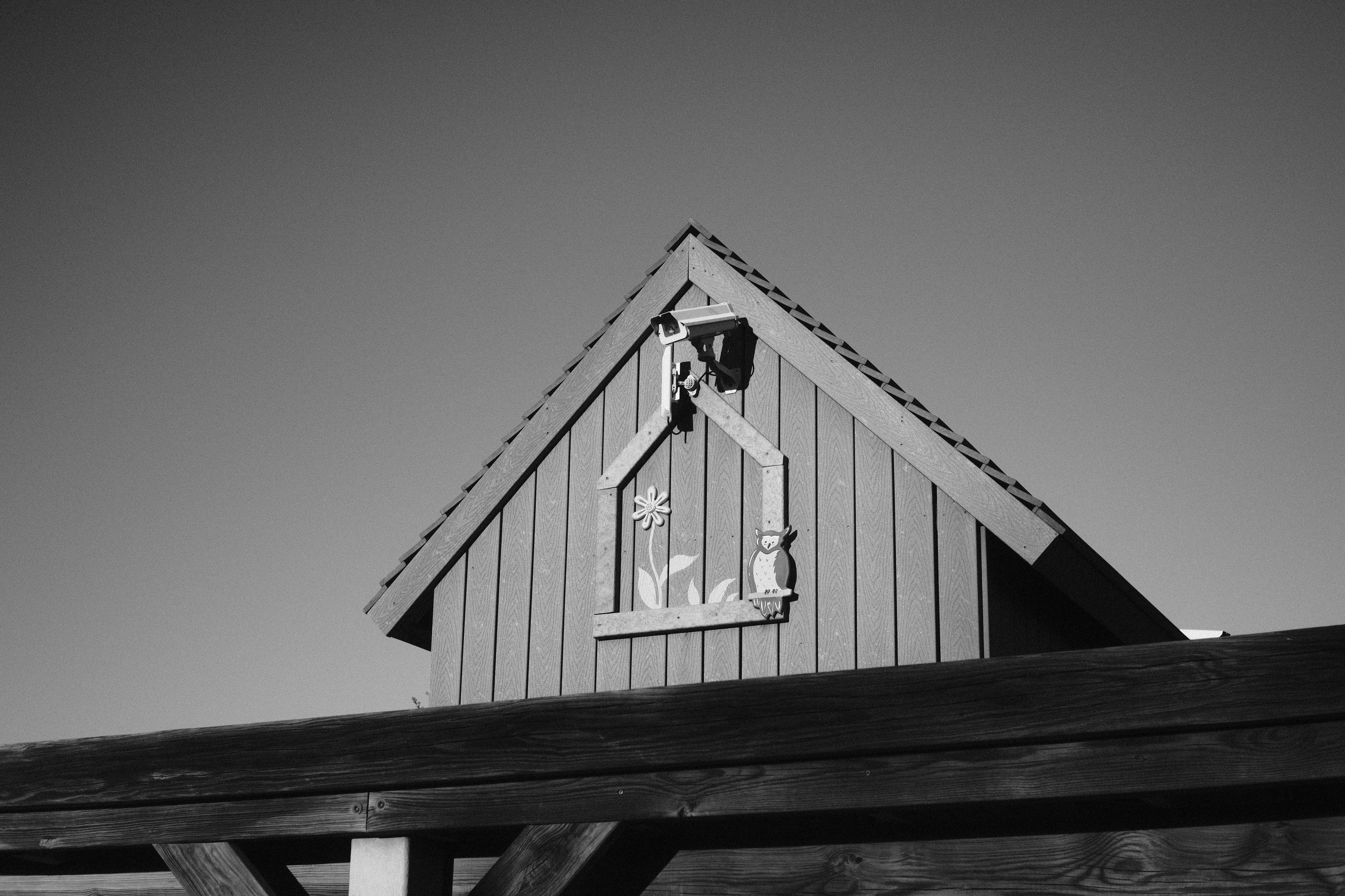 a black and white photo of a building with a clock