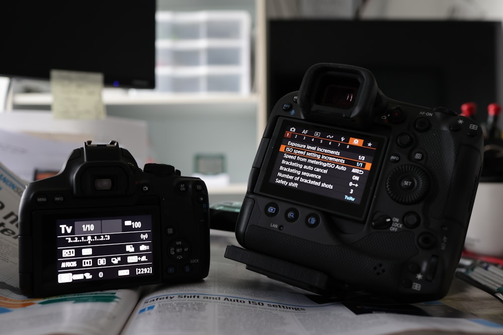 a camera sitting on top of a table next to a monitor